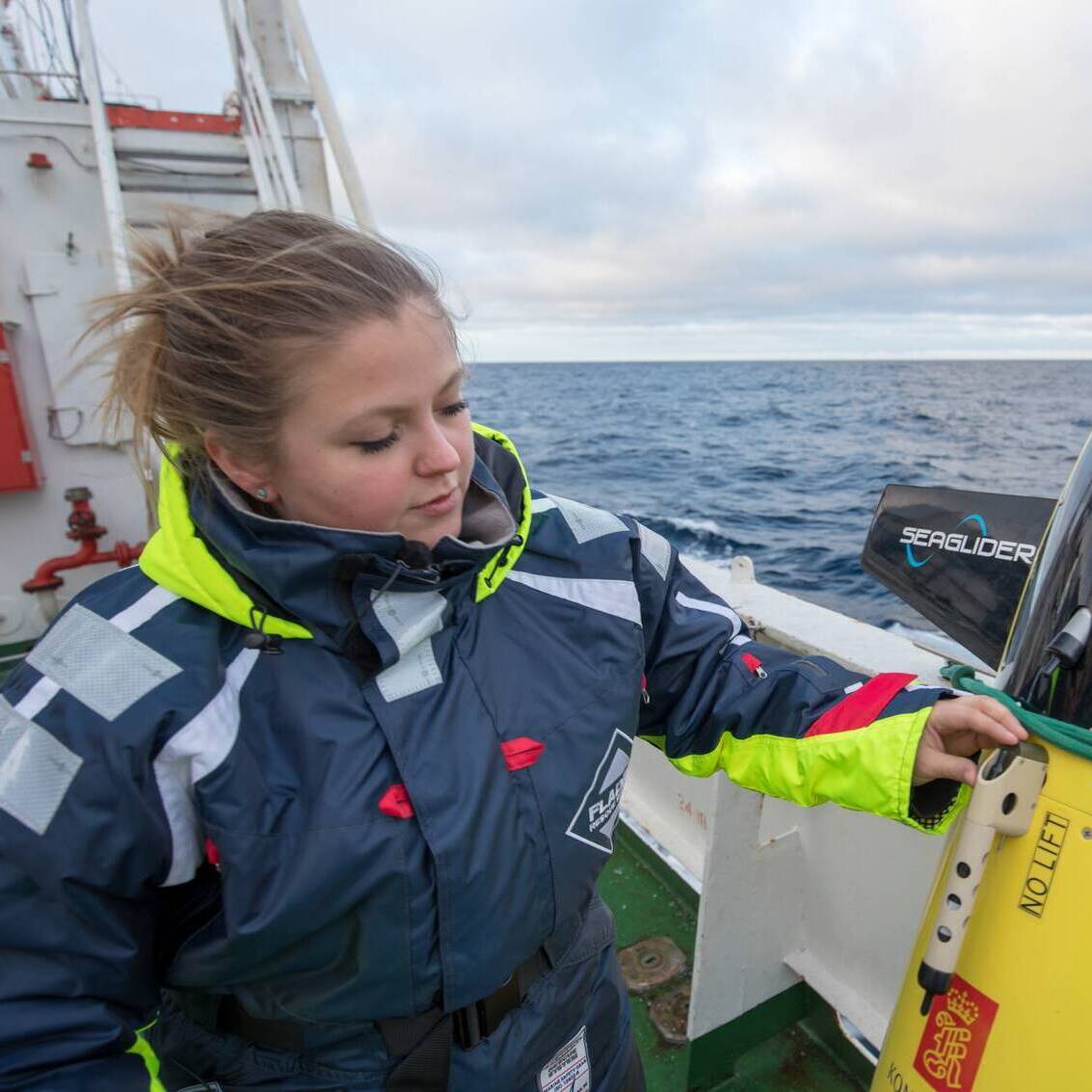 Photo of Ailin Brakstad at sea with a seaglider