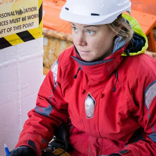 Photo of Fiona Elliott working on a ship